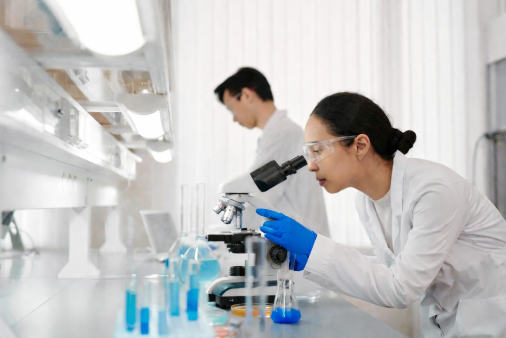 Woman looks into scope in lab wearing PF-95BL